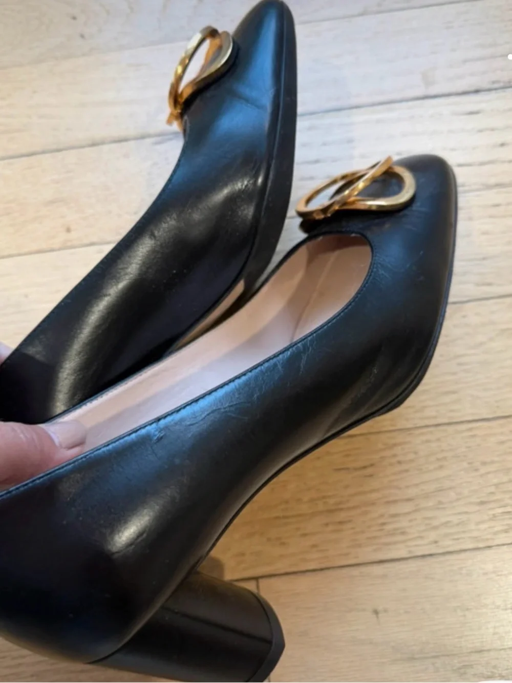 Stuart Weitzman Black Leather Pumps with Gold Buckle Accent